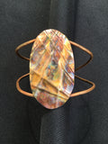Large form-folded oval on flame painted copper with 2 wires