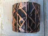 Black form-folded  2 inch wide copper cuff with black removed so beauty of the copper shines through