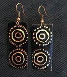 Black circle dots using aborigine pattern. Copper dot shine thru