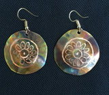 Flamed copper with daisy pattern placed into the center