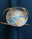 Flame painted with dragonfly etched into the round piece which attached to 2 wires